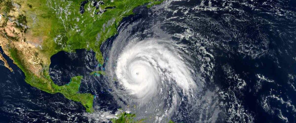 A satellite image of a hurricane approaching the eastern coast of Florida.