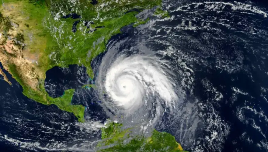 A satellite image of a hurricane approaching the eastern coast of Florida.