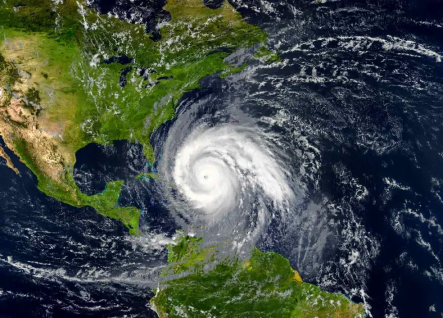 A satellite image of a hurricane approaching the eastern coast of Florida.