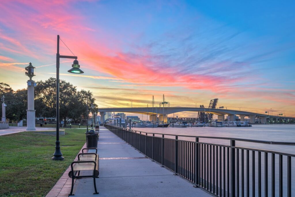 The Jacksonville riverwalk along the Saint Johns River at dusk.