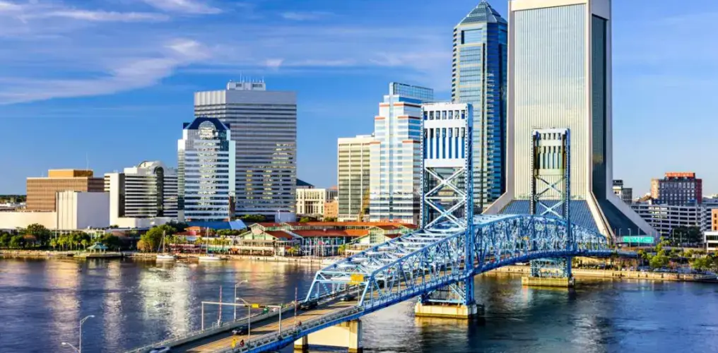 A view of the Jacksonville, FL, skyline from the Saint Johns River during the day.