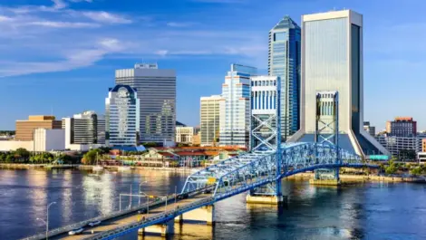 A view of the Jacksonville, FL, skyline from the Saint Johns River during the day.