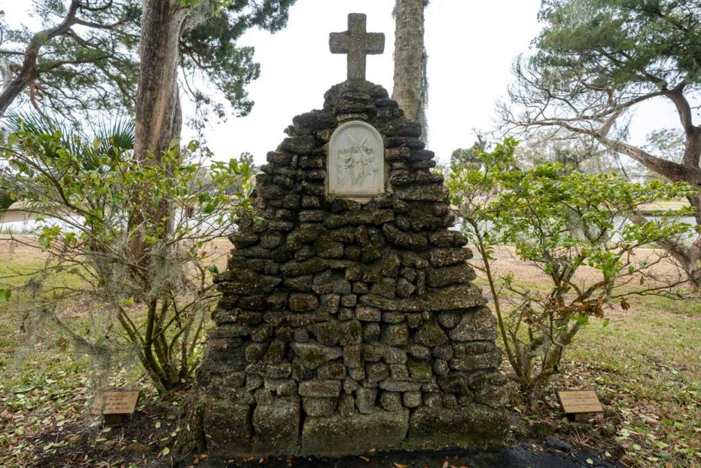 A historic old stone religion marker in a graveyard in St. Augustine, FL.